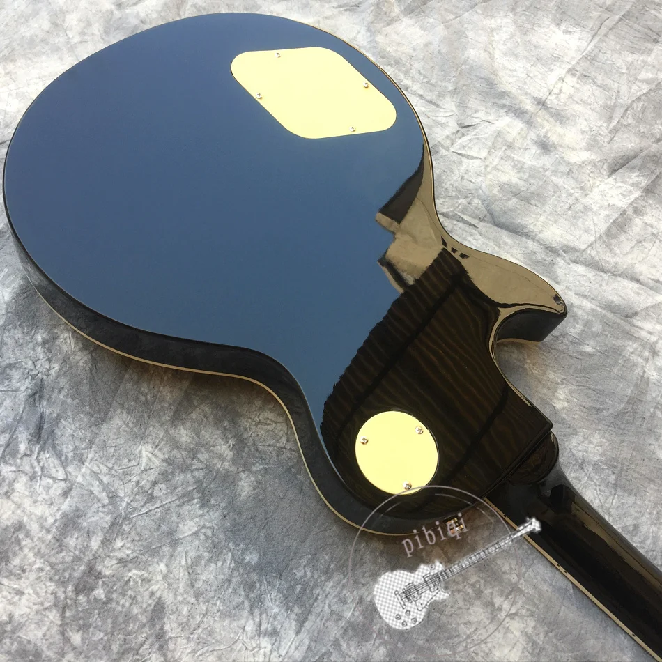 Free delivery, hot sale electric guitar, black transparent flame top, white hardware, color and logo can be customized! Free delivery, hot sale electric guitar, black transparent flame top, white hardware, color and logo can be customized!