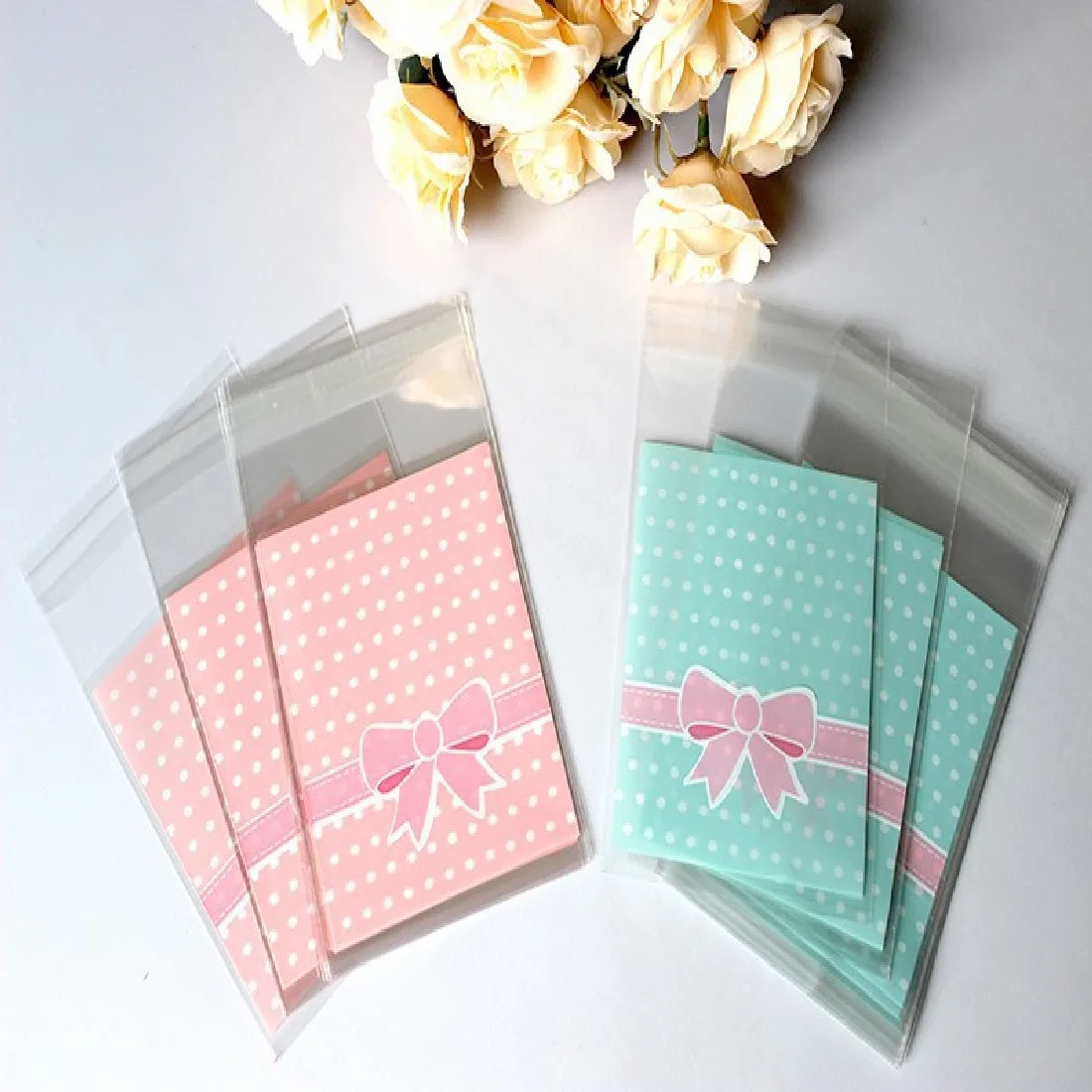 

Retail 100pcs bag OPP Plastic package bag Lovely Pink or Blue Bow Design Cake gift Packages Candy Pack paper
