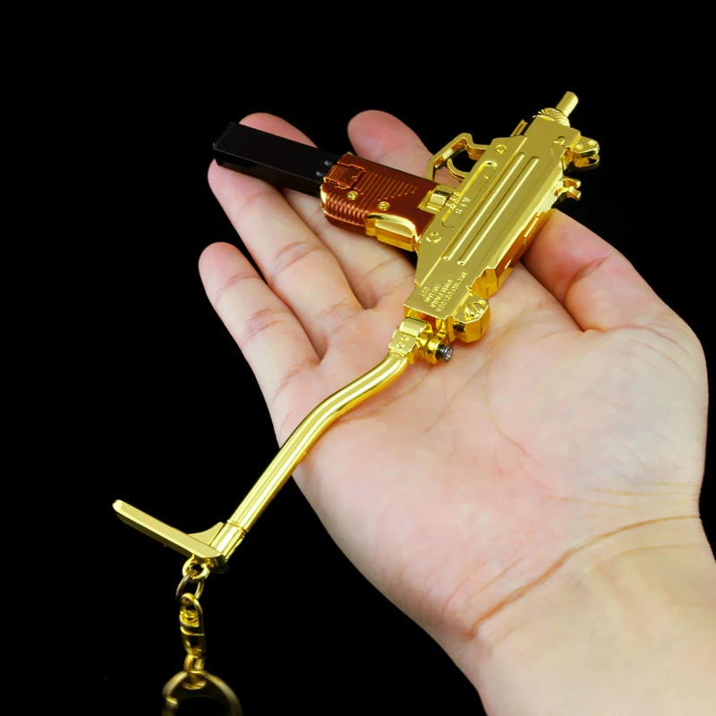 

1PCS gold Mini UZI The famous Israel gun model UZI9mm light submachine gun removable magazine clip Foldable Uzi rifle toy