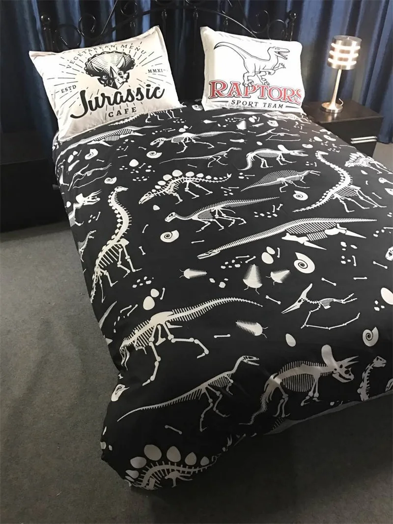 grey and white dinosaur bedding