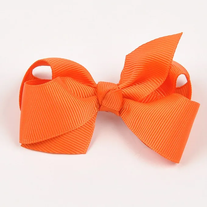 Orange boutique twisted hair bow