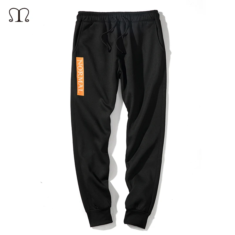 black joggers with writing