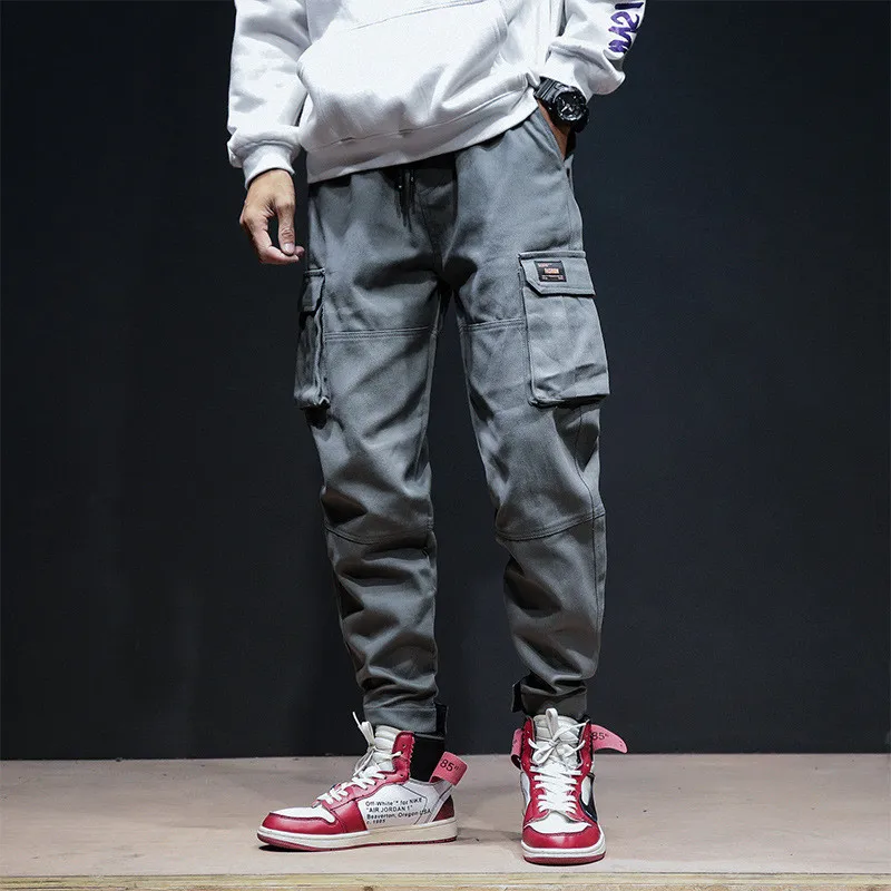 

INS men and women Chic new men's pants wild multipocket hip hop JapanStyle trend streetwear thin section loose Tooling pants