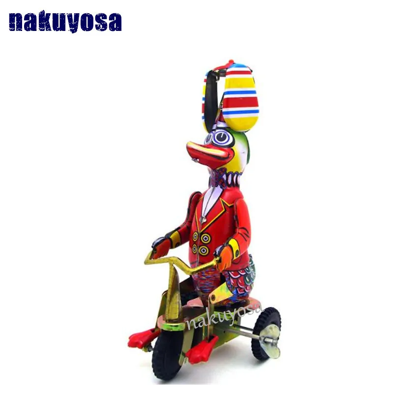 

Mr duck on bike Nostalgic retro toys adult collection toys iron clockwork toys