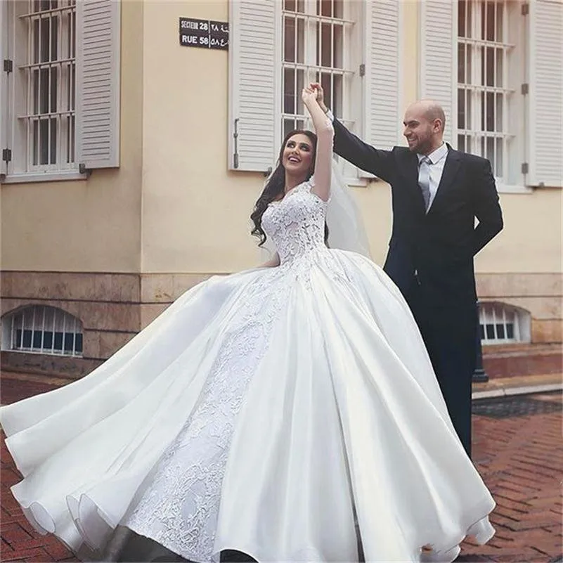 2018-new-cheap-puffy-ball-gown-wedding-dresses-sheer-long-sleeves-3d-floral-lace-appliques-floor-length-arabic-plus-size-bridal-gowns-custom_副本