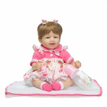 Bebé reborn de 40 cm con vestido a lunares