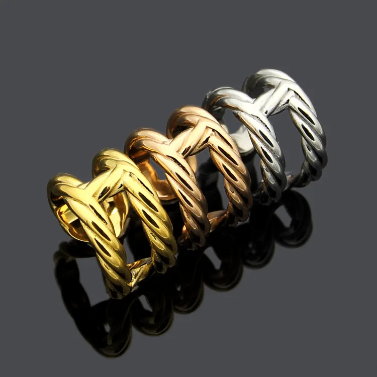 

Titanium steel jewelry H letter hollow pig nose twist open ring lady ring