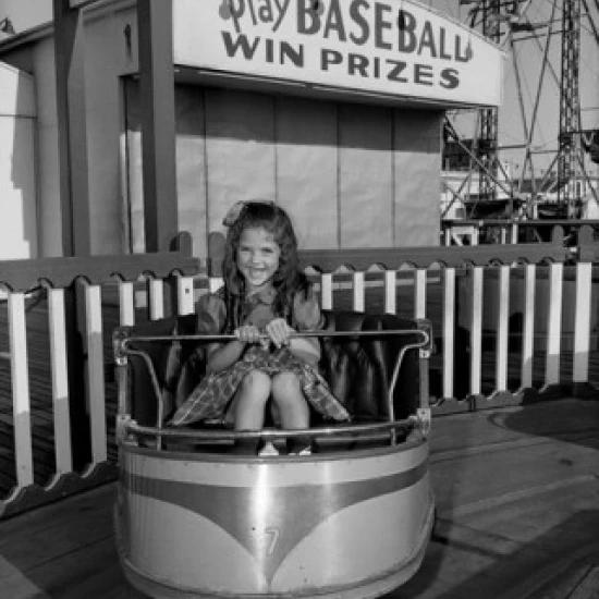 Girl on carousel  front view Poster Print (24 x 36)