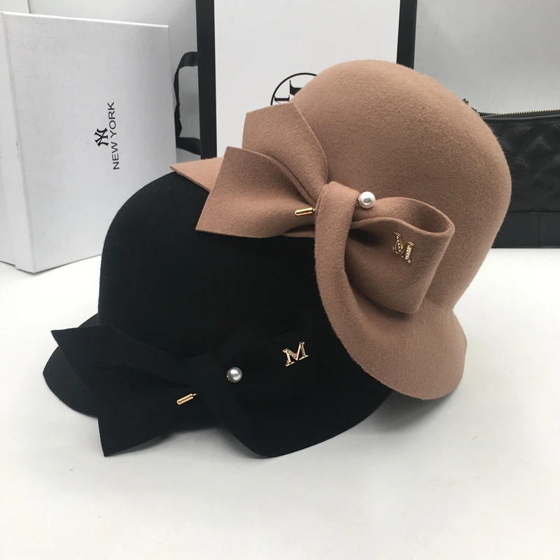 

New bucket basin of bowknot pearl wool hat Female warm fashion fisherman hat joker