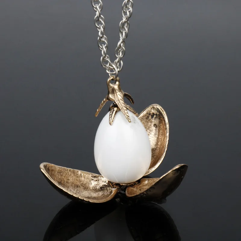 

Harri Potter Fire Dragon Egg Necklace Goblet Of Fire Rotation Activity Magic Toys Open Flower Retro Vintage Necklace Action Toys