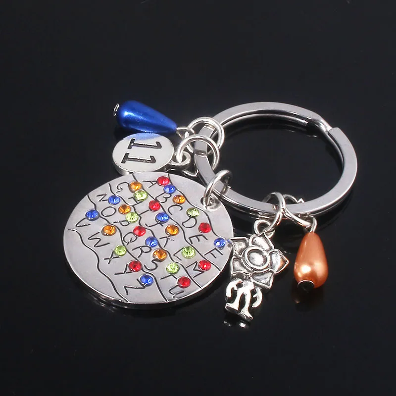 

SG Newest Stranger Things Keychain Alphabet Light Wall Monster 11 Letter Charms Metal Llavero Car Keyring Lady Choker Jewelry