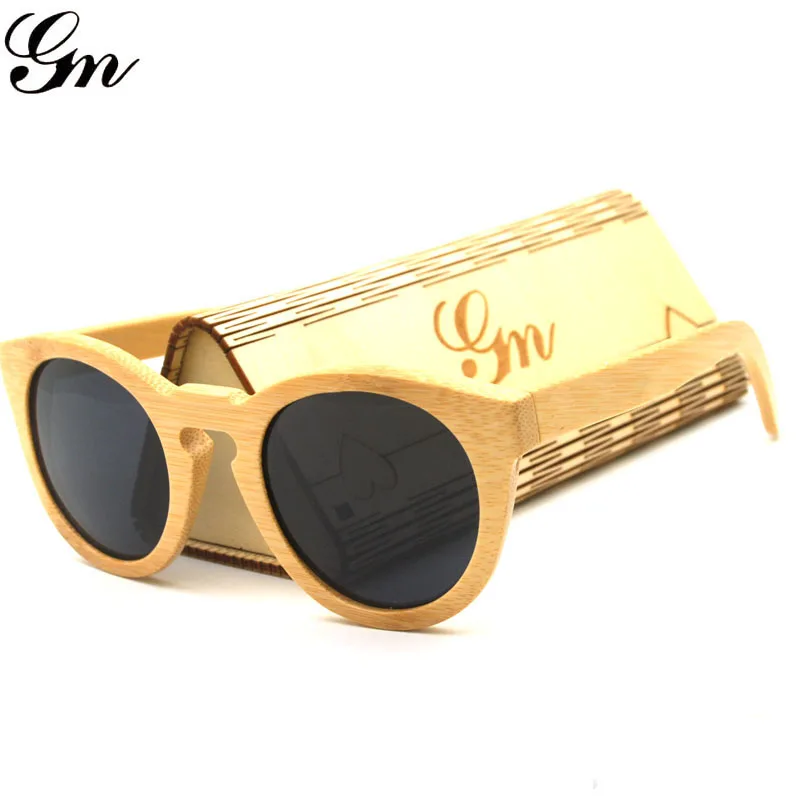

G M Design With Colored Lenses Of Bamboo Wood And Sunglasses And Sunglasses Box And Cloth.