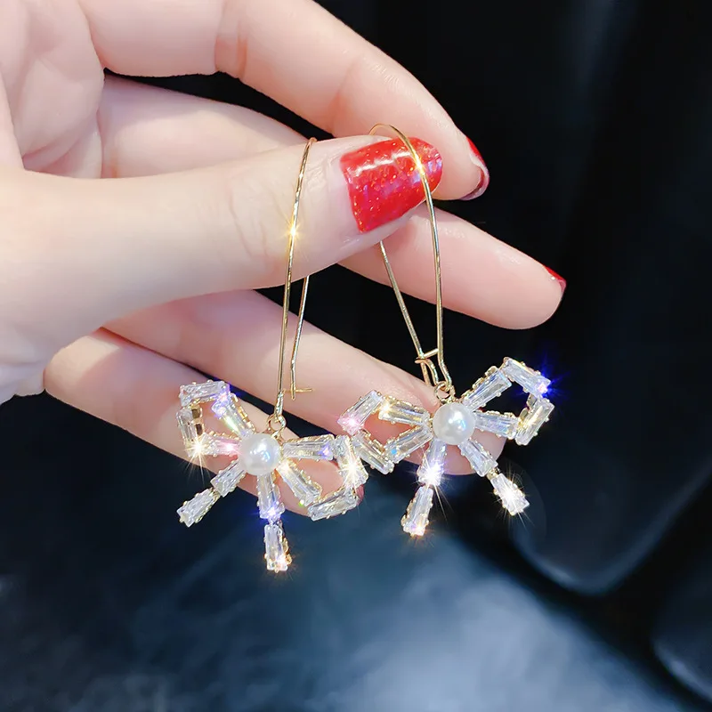 

2019 Korean Sweet Pearl Crystal Ear Drop Personality Baitao Senior Sensory Ear Jewelry Butterfly Knot Earrings Woman