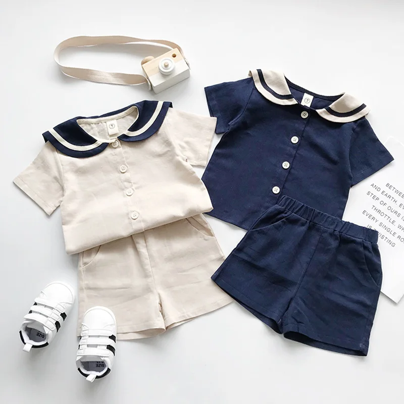 Комплекты одежды для мальчиков Новые летние комплекты для мальчиков и девочек в стиле колледжа, темно-синие хлопковые комплекты с короткими рукавами и шортами для От 1 до 6 лет, детская одежда