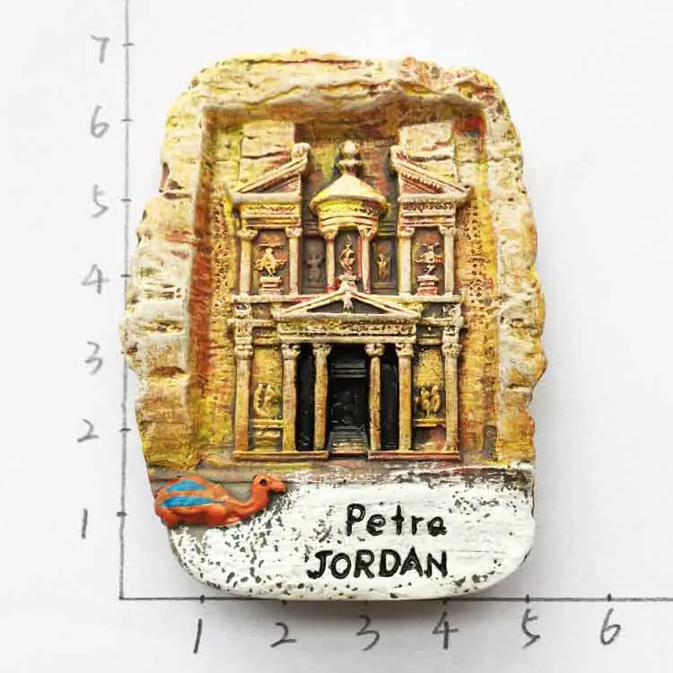 

Petra tourist souvenirs magnetically attached with hand gift promotion in the ancient city of Jordan
