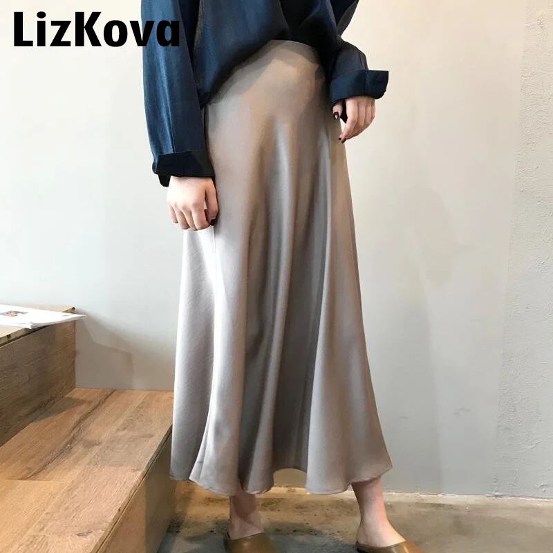 Billige 2019 frühling Köcheln Frauen Hohe Taille Satin Rock Metallic Farbe Lange Rock Glänzende Seide Nachahmung Midi Rock