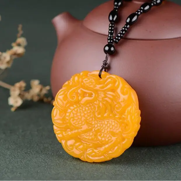 

Chinese Beautiful Natural Yellow stone Hand-Carved Kirin Luck Amulet Pendant