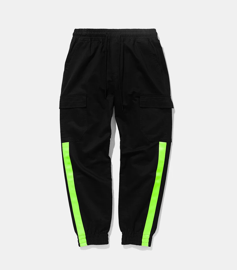 green and orange track pants