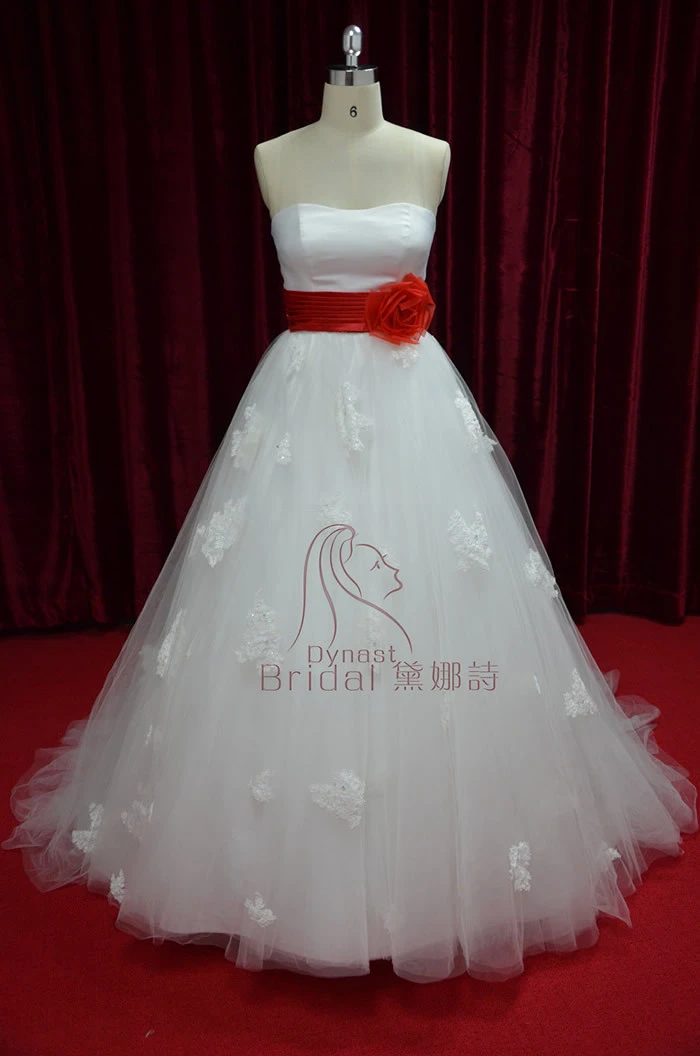 white wedding dress with red sash
