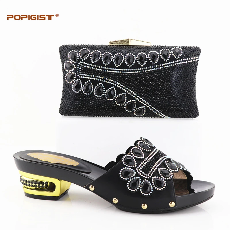 black and cream shoes with matching bag