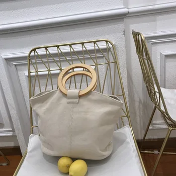 

2019 New Female Tide on The New Bag Korea Simple Wild Wooden Ring Handbag Female Canvas Bag Solid Designer