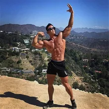 Летние новые модные брендовые мужские шорты для спортзала, Фитнес Короткие брюки для бодибилдинга до колена, Пляжные штаны с эластичной резинкой на талии, короткие спортивные штаны