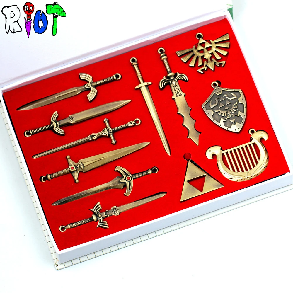 

12pcs Zelda weapons model sets sword and shield Arsenal triangle DIY necklace leather rope chain/keychain charms souvenirs gift