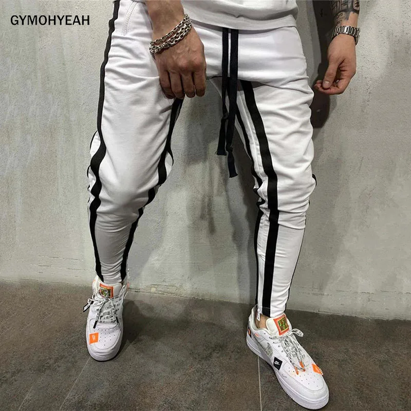 

GYMOHYEAH Men Track Pants NEW Fashion Hip Hop Fitness Streetwear Trousers Striped Drawstring Joggers Sweatpants Pantalon Homme