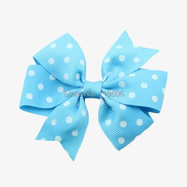 Blue Polka dot pinwheel hair bow.jpg