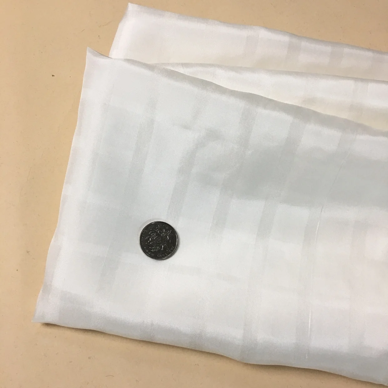 

DOBBY 100% silk fabric habotai,width:114cm,thickness:12mm,color:biege-white,length:523cm,#y59