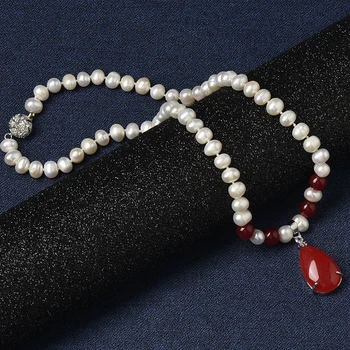 

The 8-9 mm water Natural Pearl Necklace with Four translucent red balls connected with a bright red droplet 16*26*8 mm Pend