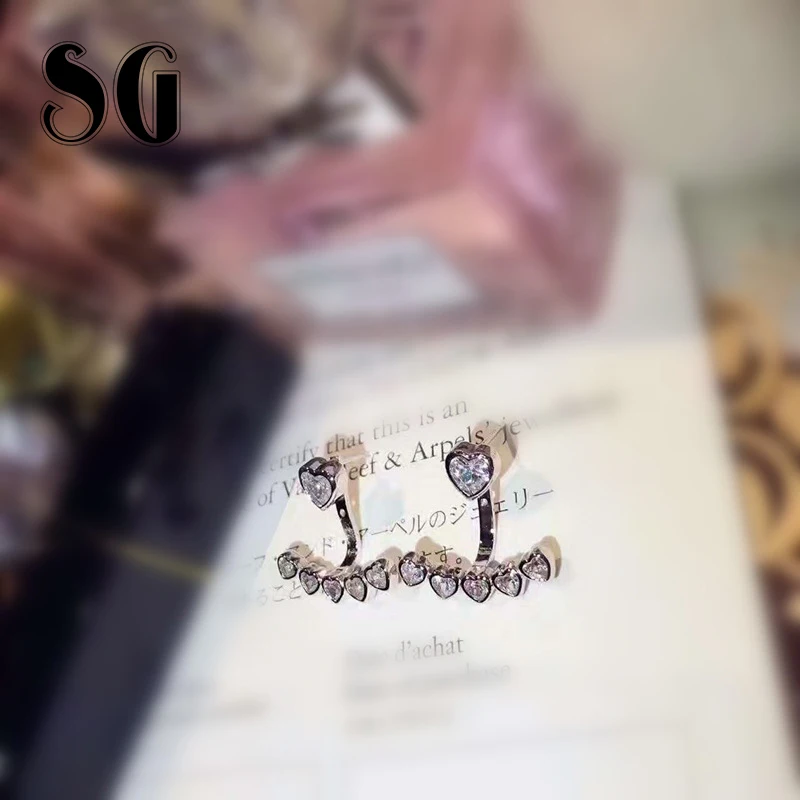 

SG 100% 925 sterling silver color jumping candy heart-shaped Stud Earrings with Clear CZ Female Aretes for Woman Fashion Jewelry