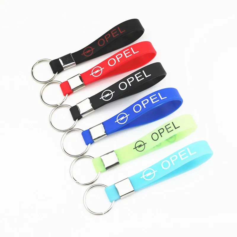 

New Car Sticker Silicone Emblem Badge Car Keychain Key Ring For OPEL Corsa Insignia Astra Antara Meriva Car Styling Accessories