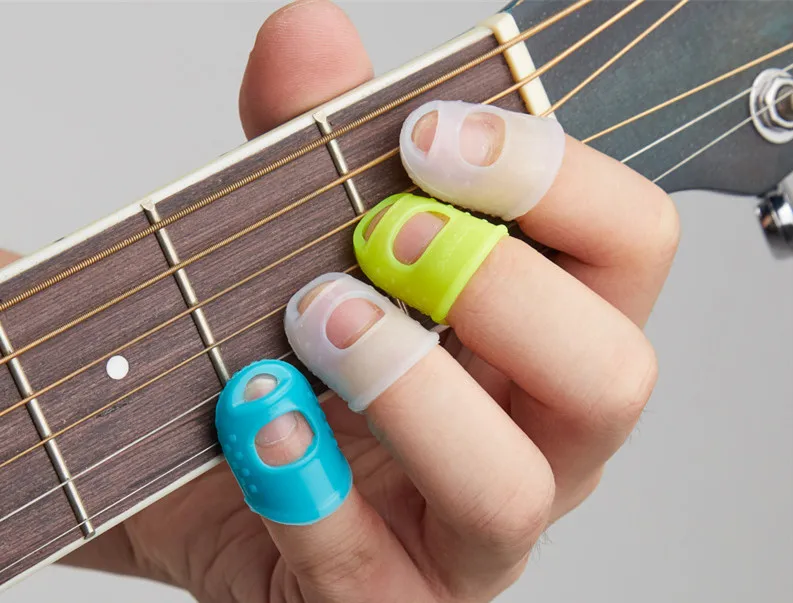 

5PCS Silicone guitar thumb sheath dial piece fingertip pin finger protection cap color random Protective Fingertip