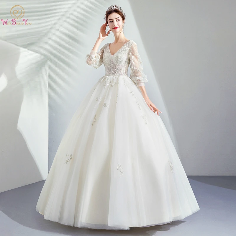 

Luxury Wedding Dresses 2019 Ivory Turkey Three Quarter Long Sleeves Beading Pearl Ball Gown V neck See Through Bridal Gowns