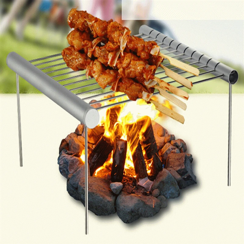Baratos 1 Pza de acero inoxidable plegable Parrilla de barbacoa de Camping portátil Mini barbacoa parrilla Rack accesorios de barbacoa para uso en el hogar y al aire libre