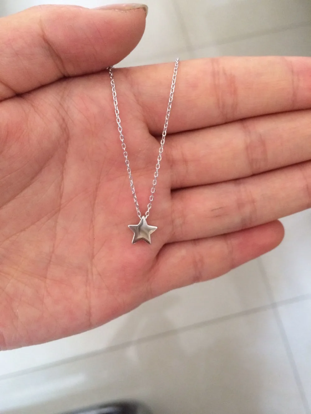 Smallest star. Подвеска Звездочка серебро. Кулон Звездочка. Колье со звездочками. Подвеска Звездочка серебро на шее.