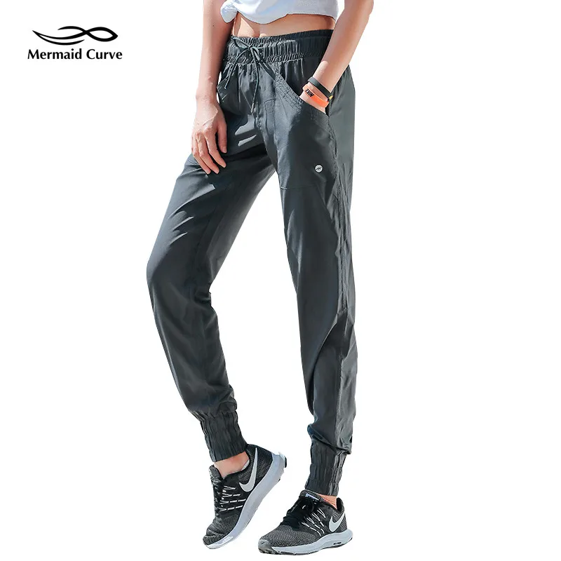 

Mermaid Curve Autumn Running Exercise Pants Female Elastic Waist Sweatpants Sports Womens Trousers Gym Fitness Loose Haren Pants