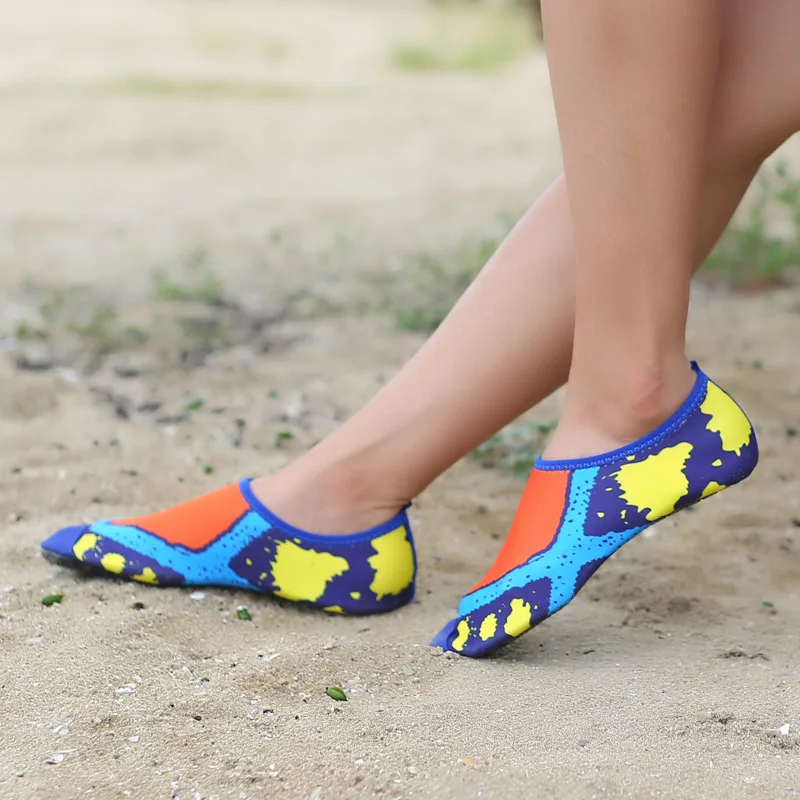 two bare feet beach shoes