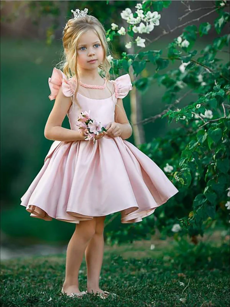 girls-pink-beaded-flutter-sleeve-special-occasion-dress-with-large-bow-8-afterchristmas-cf-color-type-flower-girl-dresses-christmas-mia-belle-overseas_382_600x.progressive