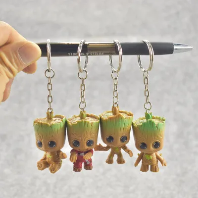 

4pcs/set New Cute Brinquedos Guardians Of The Galaxy Mini Cute Tree Man Baby Tree Model Action And Toy Figures Cartoon Cake Doll