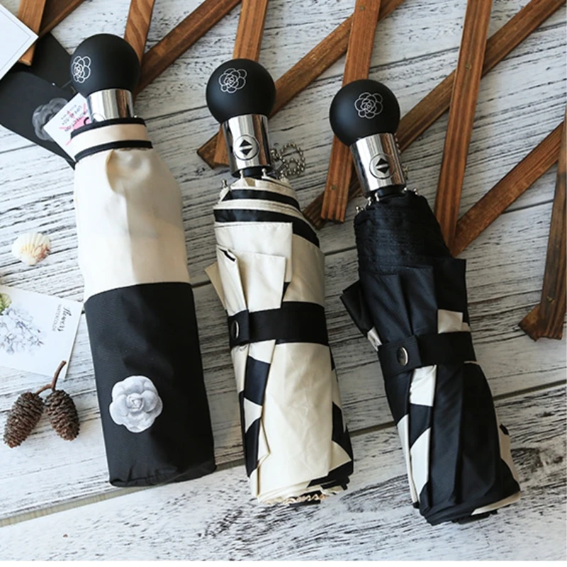 Comprar Sombrilla automática de gama alta boutique pequeña Camelia fragante sombrilla UV paraguas clásico de las mujeres