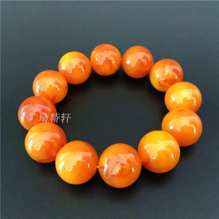 

Two generation of Poland stone skin beeswax beeswax Bracelet chicken oil yellow old honey on hand prayer beads