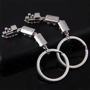 

FREE SHIPPING BY DHL 100pcs/lot Novelty Mini Train Shaped Keychains Zinc Alloy Vintage Train Keyrings for Tourist Gifts