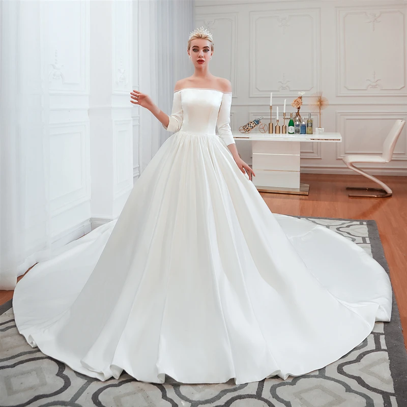 

Royal Wedding Dresses 2019 Long Sleeve Boat Neck Satin Wedding Gown Elegant Princess Ball Gown Cathedral Train Vestido de Noiva