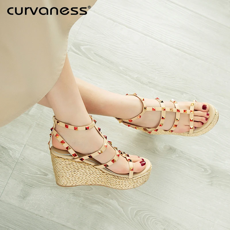 

Curvaness New Summer Women's Sandals Peep-Toe Shoes Woman High-Heeled Rivet Roman ShoesCasual Wedges For Women High Heels