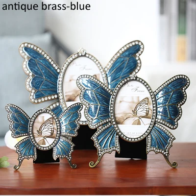 antique brass blue В форме бабочки блестящие серебрение с белым ручная роспись и стразы ювелирное 2,5x3,5 дюйм(ов) Овальный металлическая рамка для картины - Цвет: antique brass blue