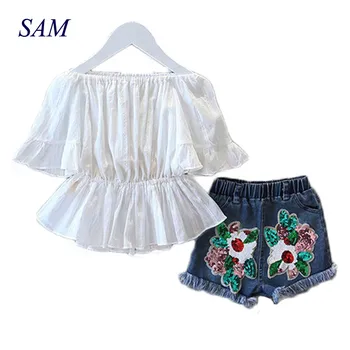 

2019 New Girls Fashion Suit Summer Word Shoulder T-shirt and Sequin Denim Shorts 2pcs / Set Waist Shirt Children's Clothing Set