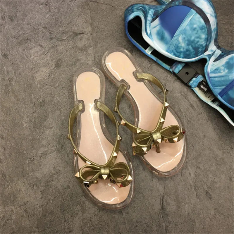 New Fashion Summer Woman Sandals Rivet Studs Flip Flops Slip On Bow knot Flat Slippers Studded Cool Beach Slides Jelly Shoes New Fashion Summer Woman Sandals Rivet Studs Flip Flops Slip On Bow knot Flat Slippers Studded Cool Beach Slides Jelly Shoes
