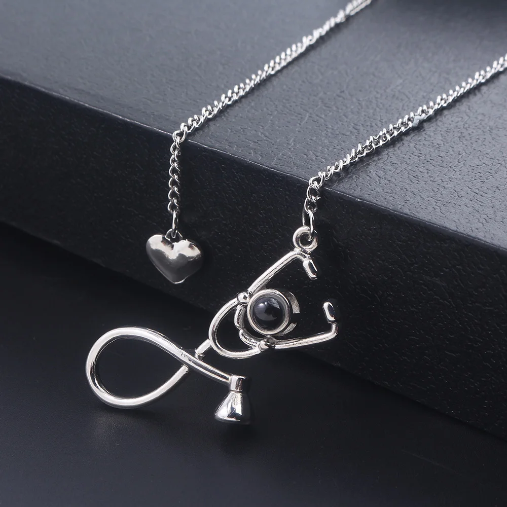 

Fashion Stethoscope Heart Pendant Necklace 100 Languages I love you Projection Collares Doctor Nurse Medical Graduation Gift